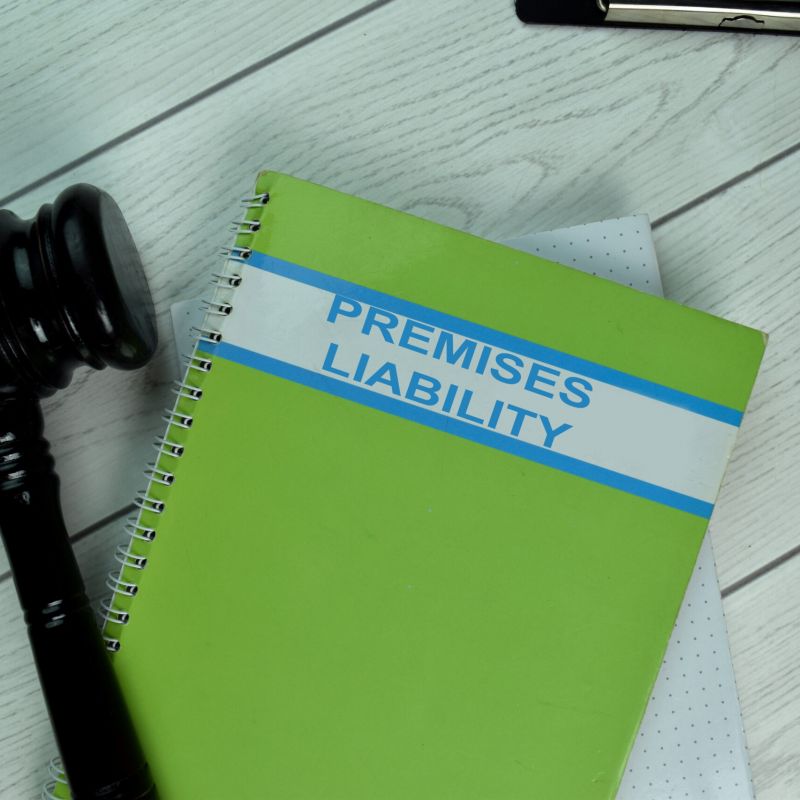 Green Book of Premises Liability on office desk with black judge gavel