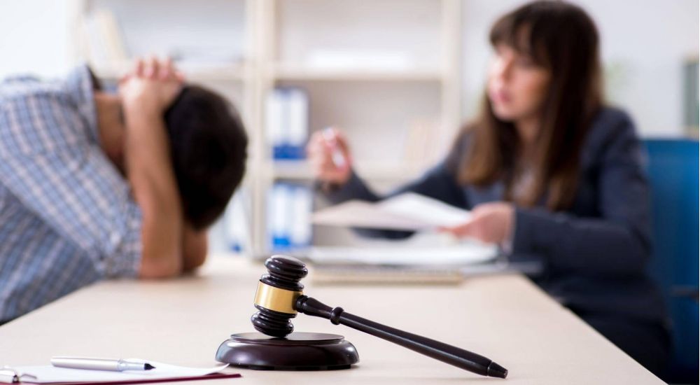 a judge and a woman in a courtroom