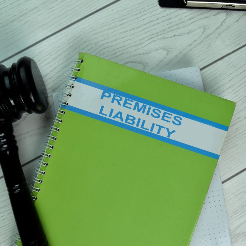 Green Book of Premises Liability on office desk with black judge gavel