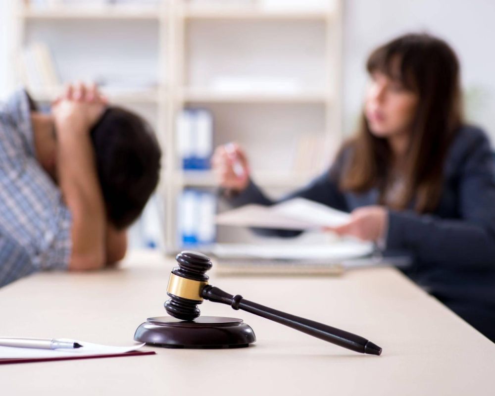 a judge and a woman in a courtroom