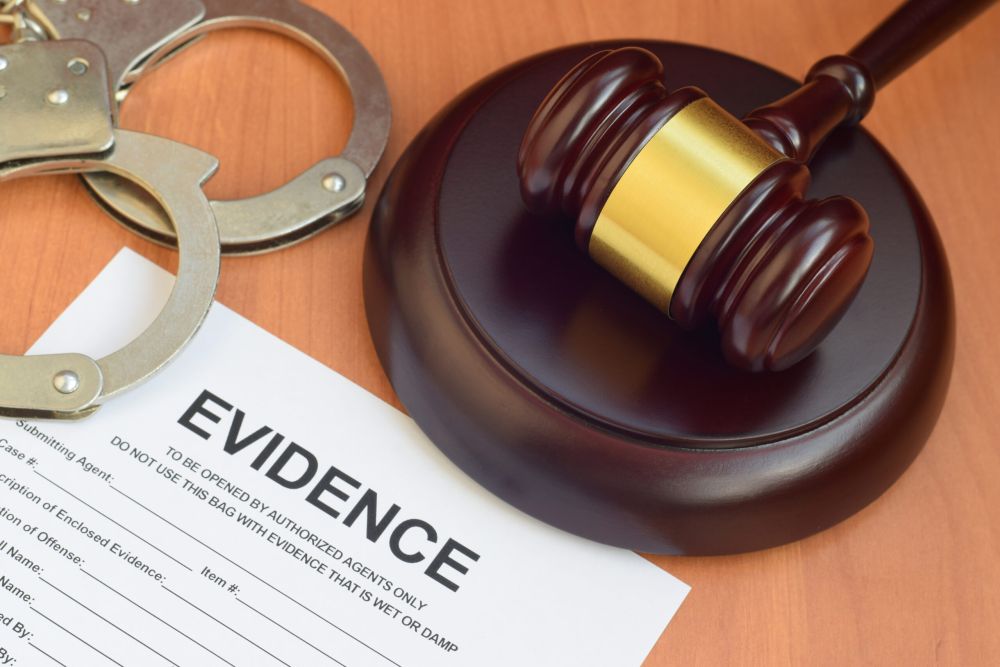 Justice mallet and evidence report blank document for investigation with police handcuffs