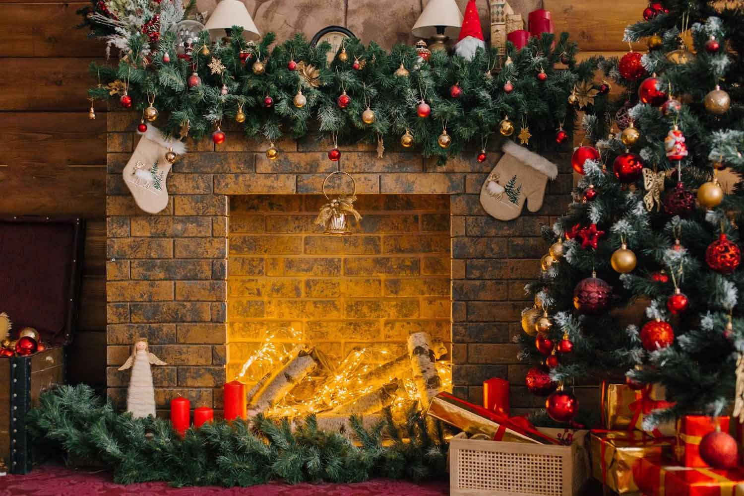 Holiday themed fireplace with vibrant red, green and gold prominent colors. The fireplace is illuminated with fiber optic LEDs in a warm white simulating the warm glow of a fire.