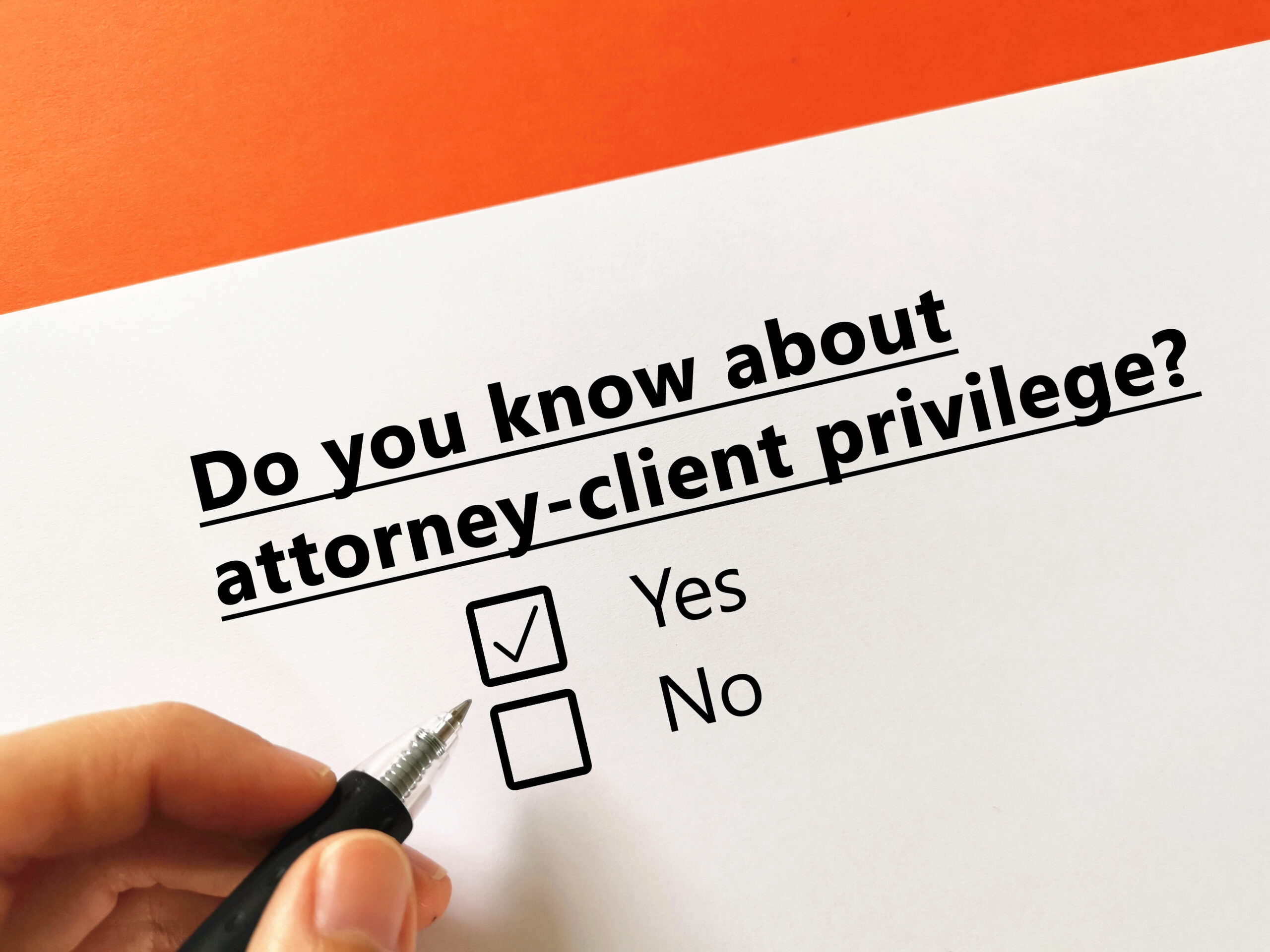 Paper and pen with question about attorney-client privilege and yes/no checkboxes