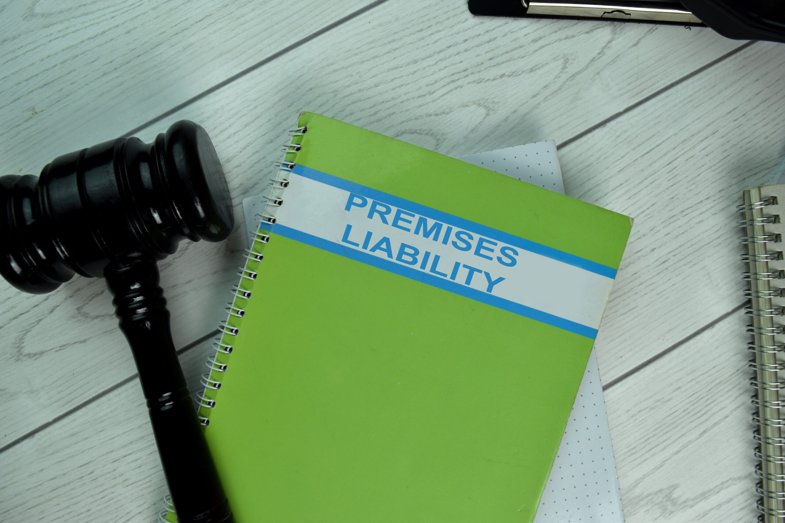 Green Book of Premises Liability on office desk with black judge gavel