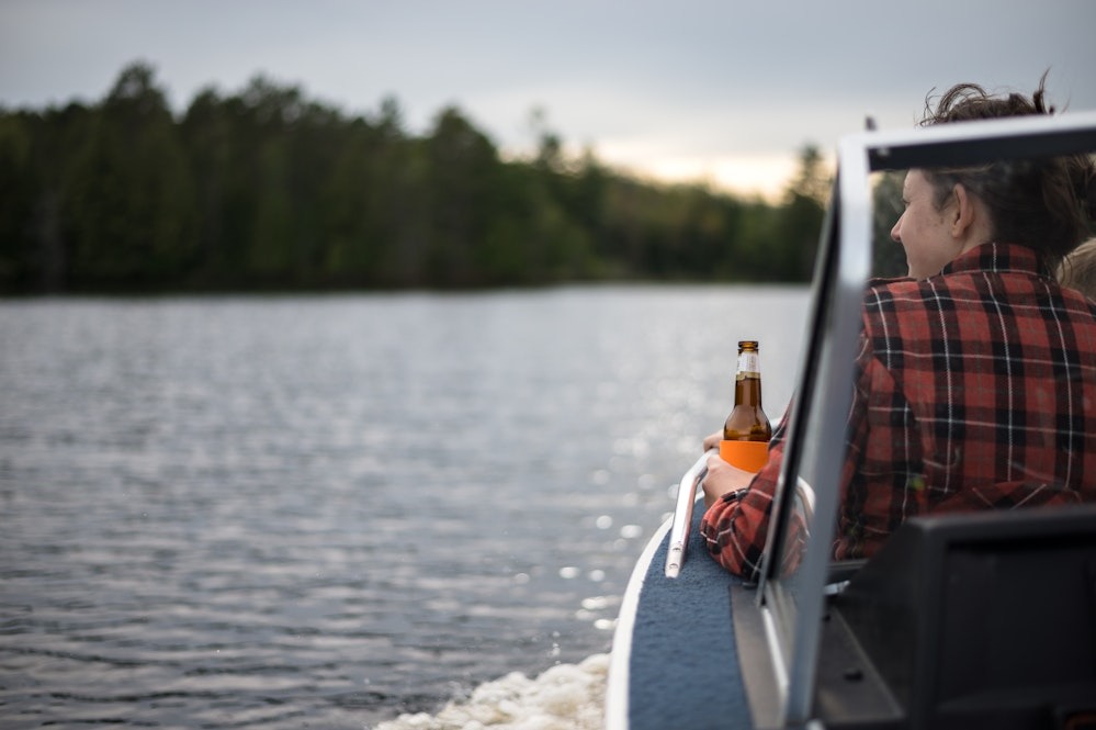 drinking a bear on a boat