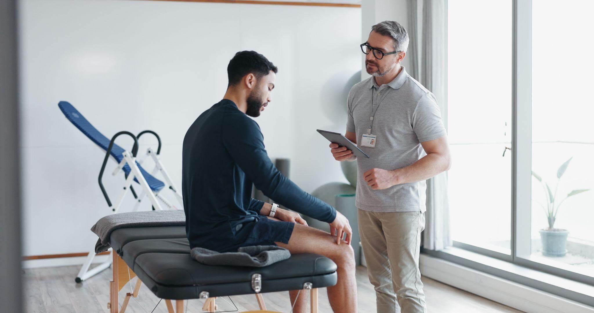 Two men, possibly a client and therapist, discussing